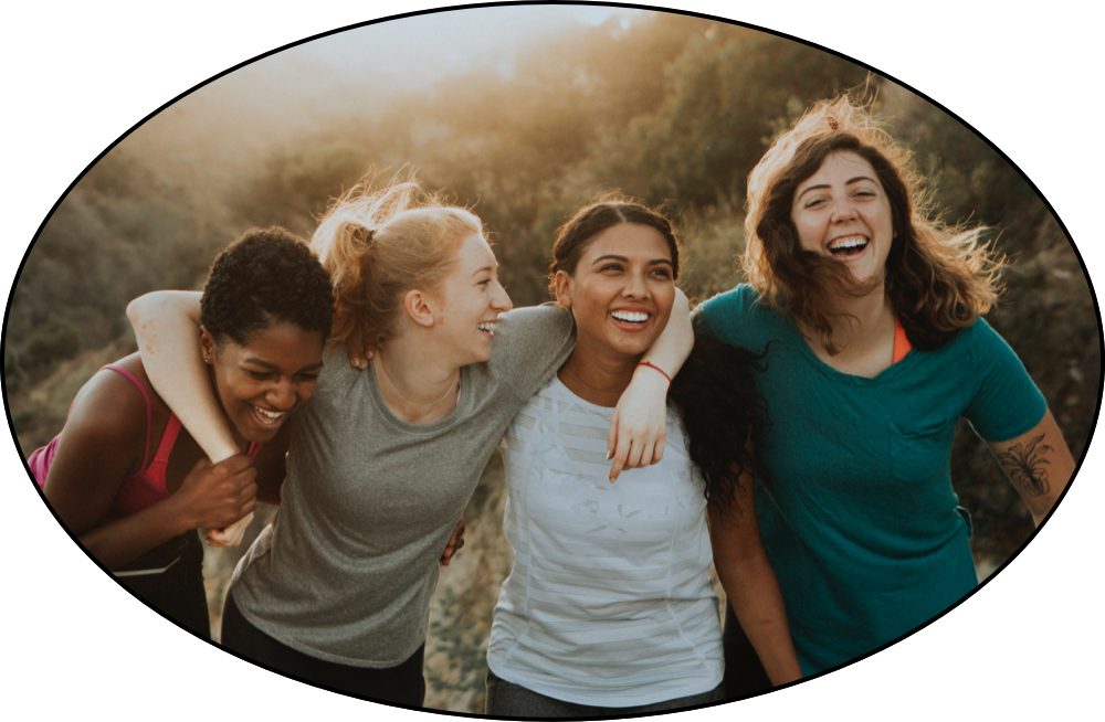 Group of friends hiking together with arms around each other